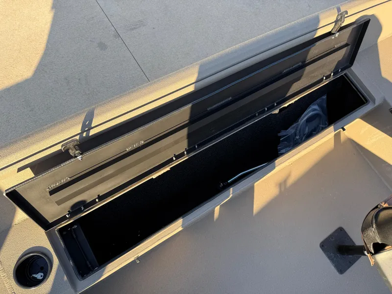 Slide: The Image of Open storage compartment in 2025 Excel 1651 River Warrior boat. - 15