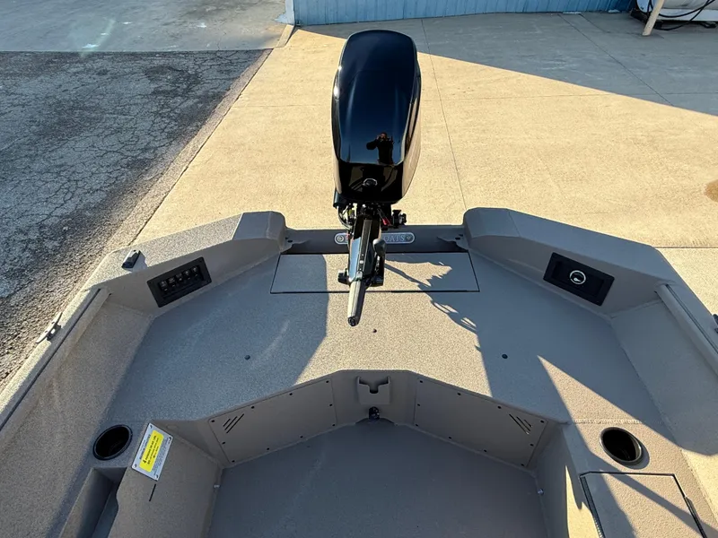 Slide: The Image of 2025 Excel 1651 River Warrior boat with motor, spacious deck, and storage compartments. - 16