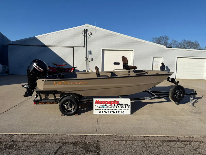 Slide: The Image of 2025 Excel 1651 River Warrior boat on trailer, parked outside Hennepin Marine. - 2