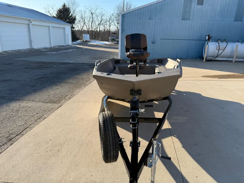 Slide: The Image of 2025 Excel 1651 River Warrior boat on trailer, parked outdoors. - 4