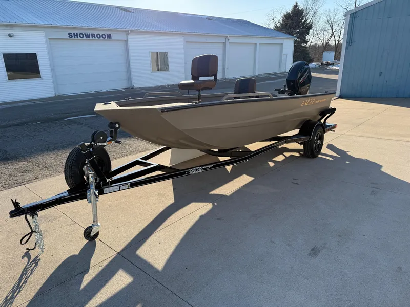 Slide: The Image of 2025 Excel 1651 River Warrior boat on trailer outside showroom. - 5