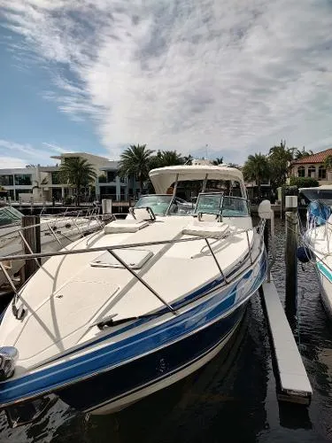 Slide: The Image of 2017 Formula 37 PC yacht docked at a marina under a partly cloudy sky. - 11
