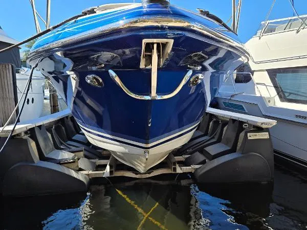 Slide: The Image of 2017 Formula 37 PC boat docked, showcasing sleek blue hull and twin engines. - 14