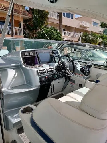 Slide: The Image of 2017 Formula 37 PC yacht cockpit with modern navigation equipment and luxurious seating. - 18
