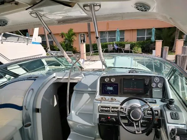 Slide: The Image of 2017 Formula 37 PC yacht cockpit with modern navigation controls and luxurious seating. - 19