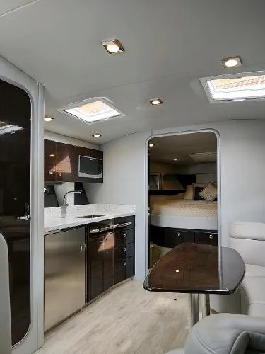 Slide: The Image of Interior of 2017 Formula 37 PC yacht with modern kitchen and cozy sleeping area. - 23