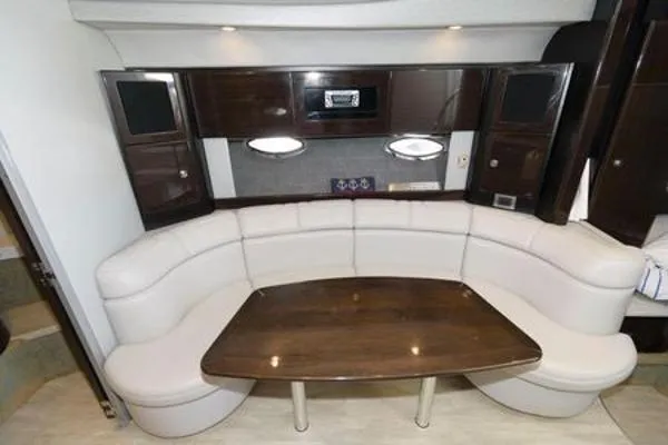 Slide: The Image of Luxurious interior of 2017 Formula 37 PC yacht with curved seating and wooden table. - 32