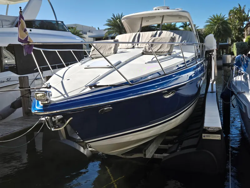 Slide: The Image of 2017 Formula 37 PC yacht docked, featuring sleek design and blue hull. - 5