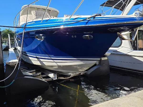 Slide: The Image of 2017 Formula 37 PC boat docked, featuring a sleek blue hull design. - 7