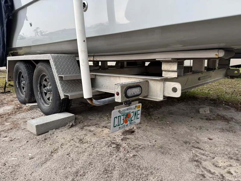 Slide: The Image of Trailer of a 2019 World Cat 230 CC boat with Florida license plate. - 18