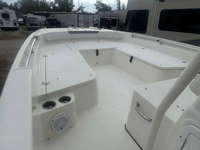 Slide: The Image of 2019 World Cat 230 CC boat interior with seating and storage compartments. - 8
