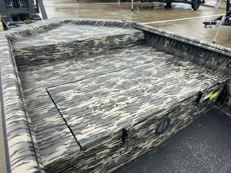 Slide: The Image of 2025 Havoc Boats 1656 VJST with camouflage interior design on a wet surface. - 9