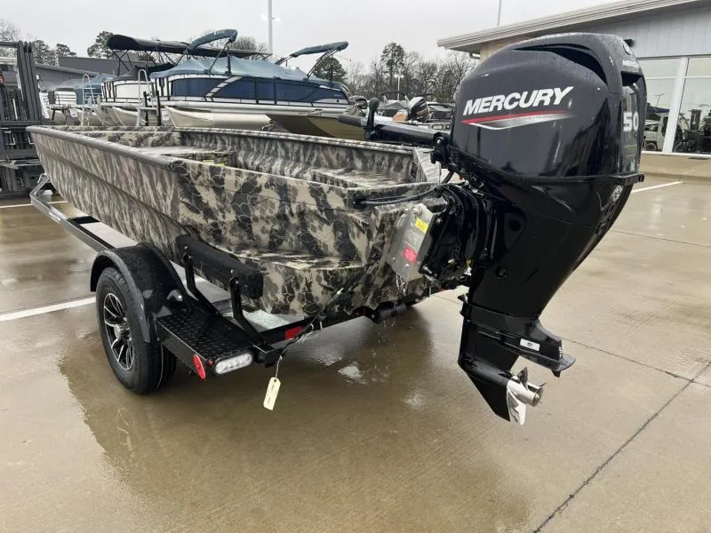 Slide: The Image of 2025 Havoc Boats 1656 VJST with Mercury 50 engine on trailer, parked outdoors. - 5