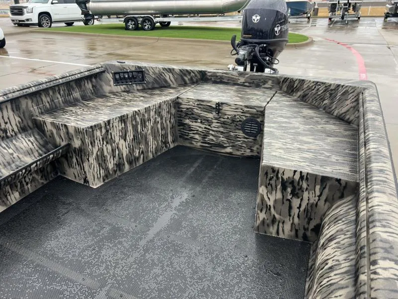 Slide: The Image of 2025 Havoc Boats 1656 VJST interior with camouflage design, featuring spacious seating and storage. - 10