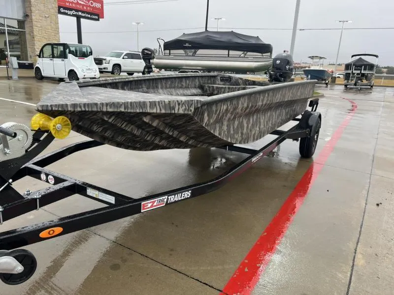 Slide: The Image of 2025 Havoc Boats 1656 VJST on trailer in rainy dealership lot. - 7