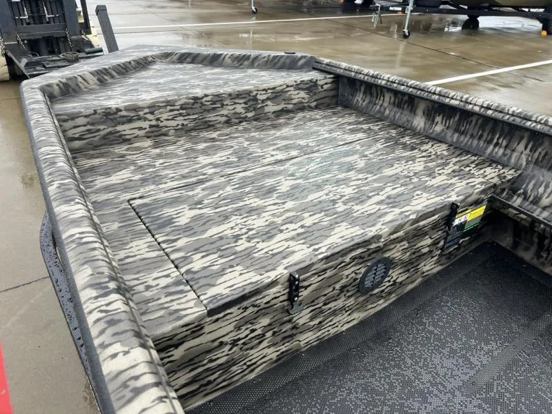 Slide: The Image of 2025 Havoc Boats 1656 VJST with camouflage design on a wet dock. - 9