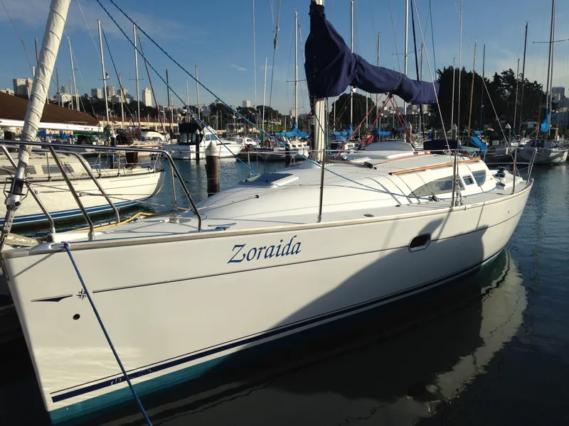 Slide: The Image of 2003 Jeanneau Sun Odyssey 32i sailboat docked in a marina. - 16