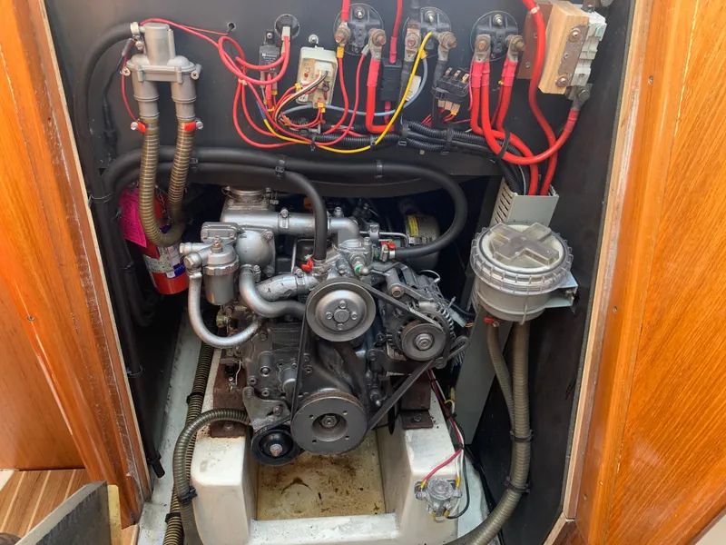 Slide: The Image of Engine compartment of a 2003 Jeanneau Sun Odyssey 32i sailboat, showcasing wiring and components. - 17