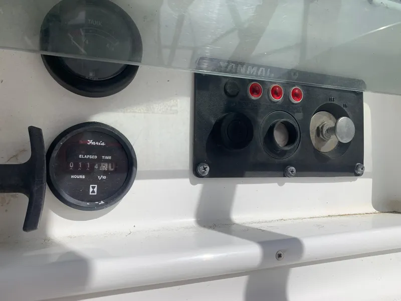 Slide: The Image of Control panel of 2003 Jeanneau Sun Odyssey 32i sailboat, featuring gauges and switches. - 19