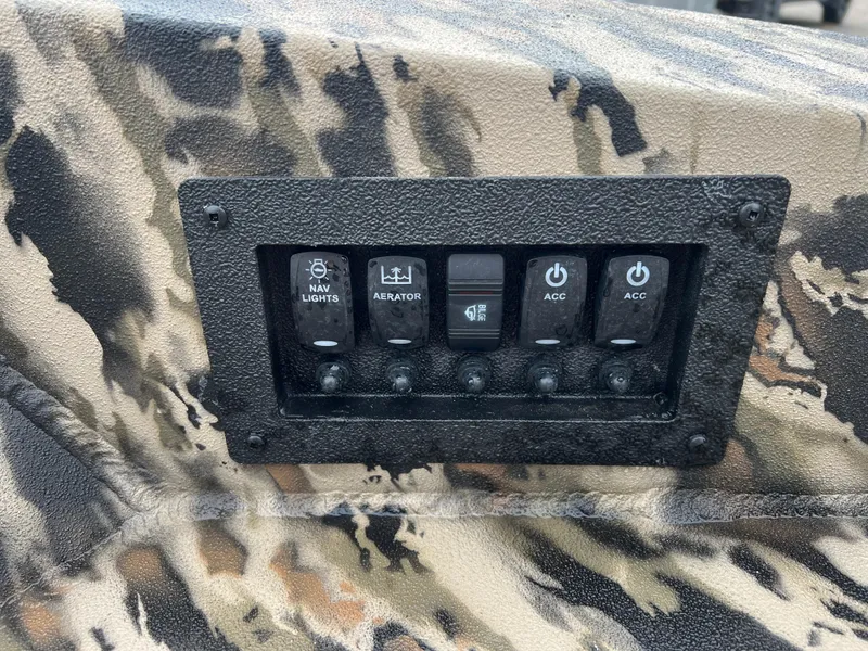 Slide: The Image of Control panel of 2025 Excel 1651 River Warrior boat with camouflage design. - 15
