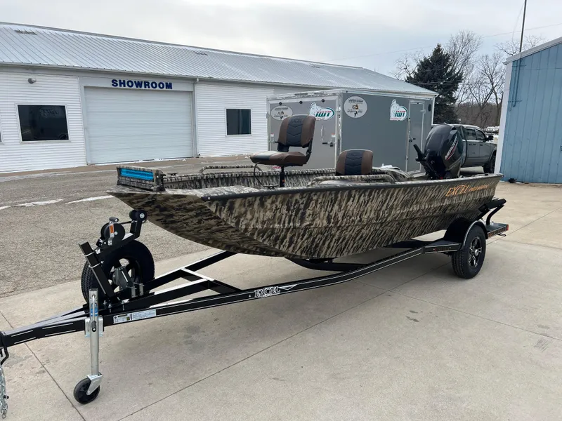 Slide: The Image of 2025 Excel 1651 River Warrior boat on trailer outside showroom. - 2