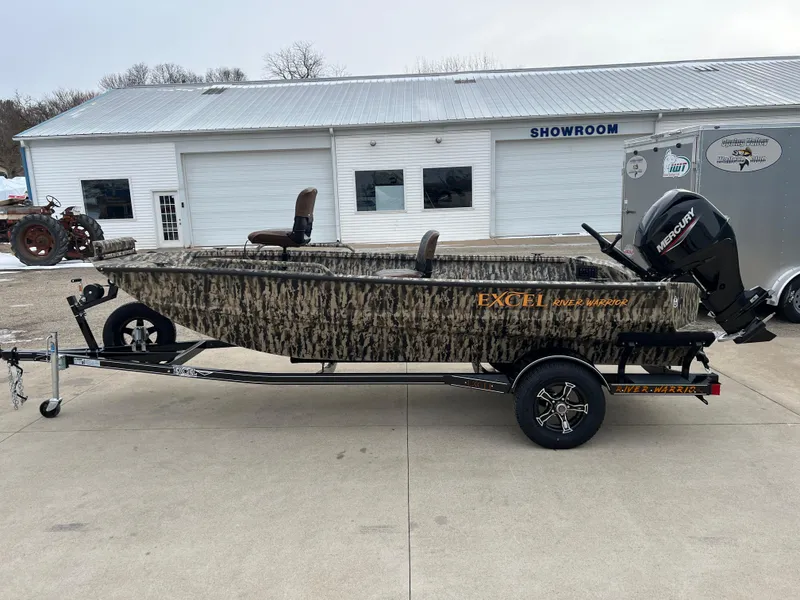 Slide: The Image of 2025 Excel 1651 River Warrior boat with camouflage design on a trailer outside a showroom. - 3