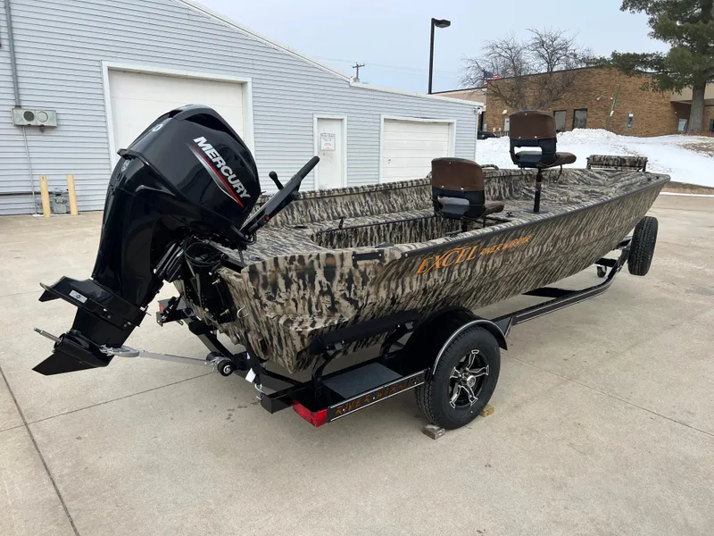 Slide: The Image of 2025 Excel 1651 River Warrior boat with Mercury outboard motor, parked on a trailer. - 6