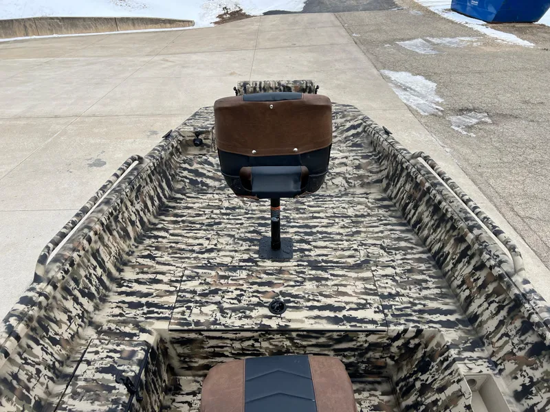 Slide: The Image of 2025 Excel 1651 River Warrior boat with camouflage pattern and brown seat. - 9