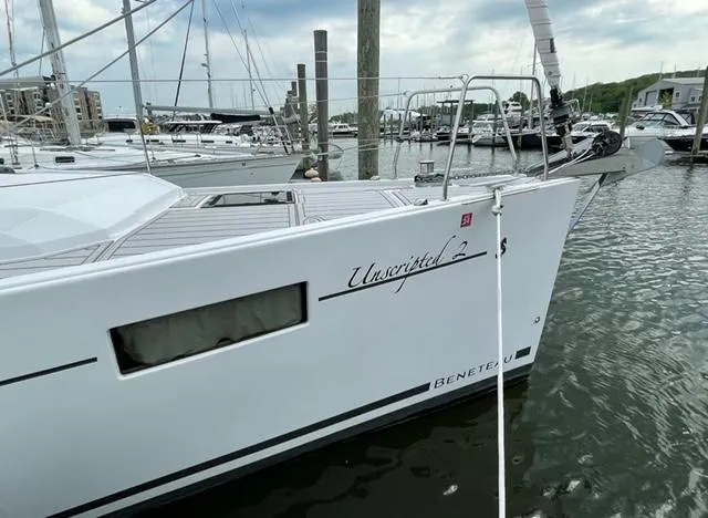 Slide: The Image of 2018 Beneteau Oceanis 41.1 sailboat docked in marina, featuring sleek design and modern amenities. - 11