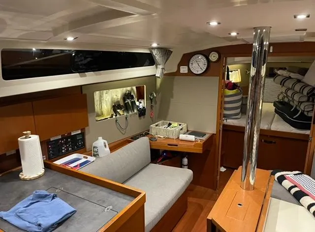 Slide: The Image of Interior of 2018 Beneteau Oceanis 41.1 yacht, featuring cozy seating and modern amenities. - 14
