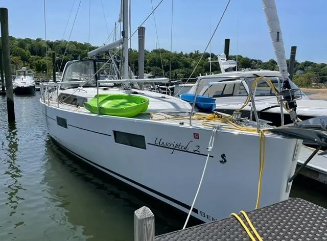 Slide: The Image of 2018 Beneteau Oceanis 41.1 sailboat docked at marina with kayak on deck. - 7