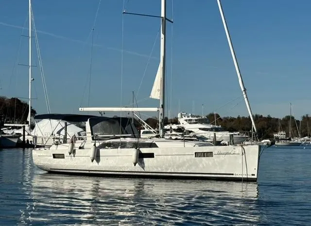 Slide: The Image of 2018 Beneteau Oceanis 41.1 sailboat on calm water, docked at marina. - 9