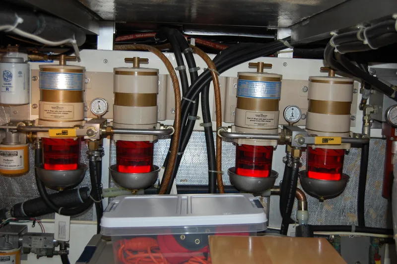 Slide: The Image of Engine room of a 2002 Eagle Pilothouse with fuel filters and gauges. - 14