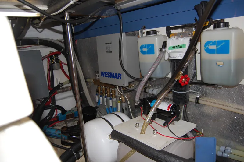 Slide: The Image of Engine room of 2002 Eagle Pilothouse with Wesmar equipment and fluid containers. - 19