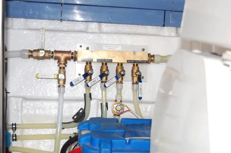 Slide: The Image of Plumbing system in a 2002 Eagle Pilothouse boat, featuring labeled valves and pipes. - 20