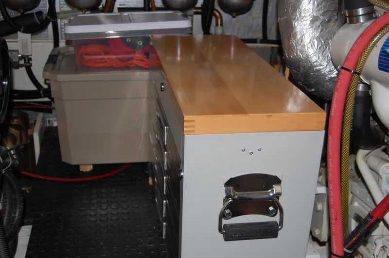Slide: The Image of Engine room of 2002 Eagle Pilothouse with storage and equipment. - 24