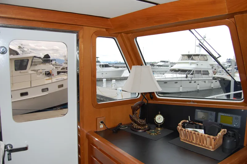 Slide: The Image of Interior view of 2002 Eagle Pilothouse with marina in background. - 45