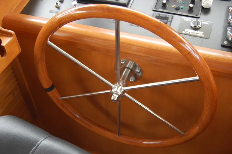 Slide: The Image of Wooden steering wheel on a 2002 Eagle Pilothouse boat. - 47