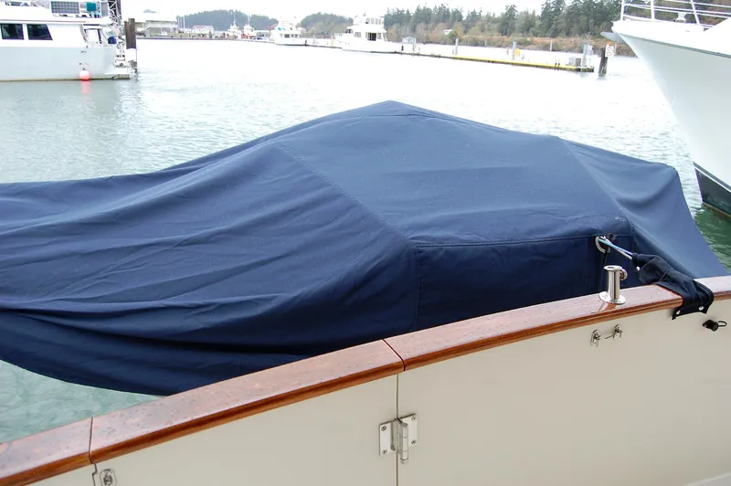 Slide: The Image of Covered 2002 Eagle Pilothouse boat docked in a marina. - 7