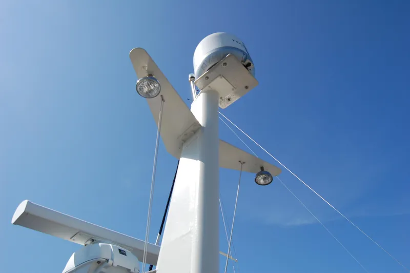 Slide: The Image of Radar and lights on a 2002 Eagle Pilothouse against a clear blue sky. - 9