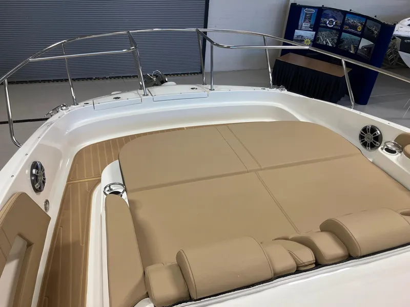Slide: The Image of 2025 Sea Ray Sundancer 320 boat with spacious sunbathing deck and sleek design. - 20
