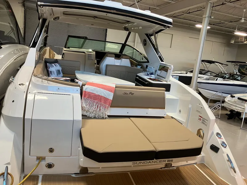 Slide: The Image of 2025 Sea Ray Sundancer 320 yacht interior with seating and modern amenities. - 5