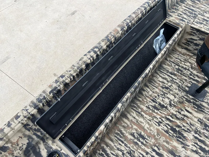 Slide: The Image of 2025 Excel 1751 River Warrior boat with open storage compartment, camo design. - 12