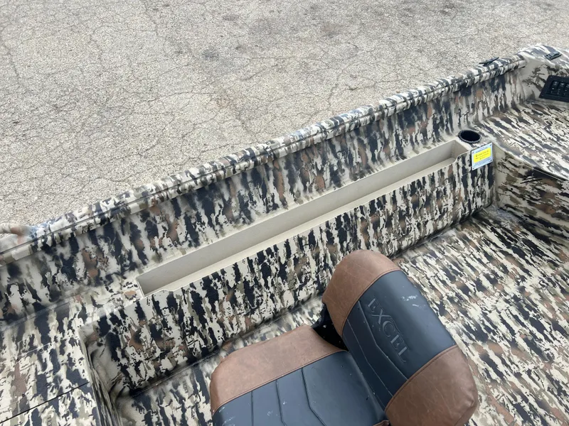 Slide: The Image of 2025 Excel 1751 River Warrior boat interior with camouflage design and seating. - 13