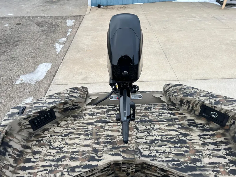 Slide: The Image of 2025 Excel 1751 River Warrior boat with camouflage design and outboard motor. - 15