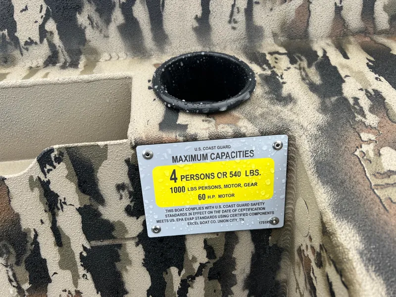 Slide: The Image of Boat capacity label on 2025 Excel 1751 River Warrior, camouflage pattern, 4-person limit. - 18