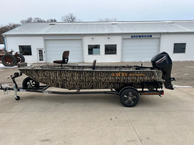 Slide: The Image of 2025 Excel 1751 River Warrior boat with camouflage design outside a showroom. - 3