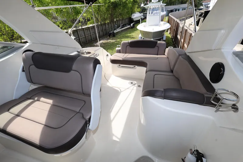Slide: The Image of 2014 Sea Ray 280 Sundancer interior with spacious seating and modern design. - 15