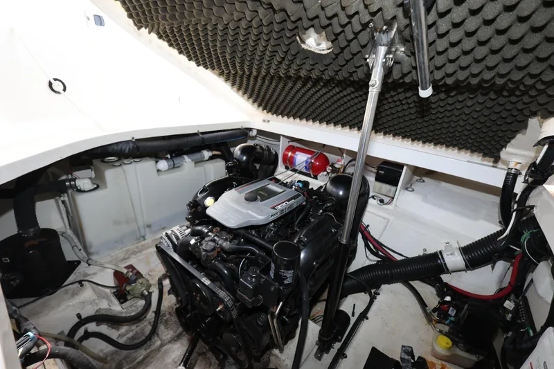 Slide: The Image of Engine compartment of 2014 Sea Ray 280 Sundancer boat, featuring detailed mechanical components. - 26