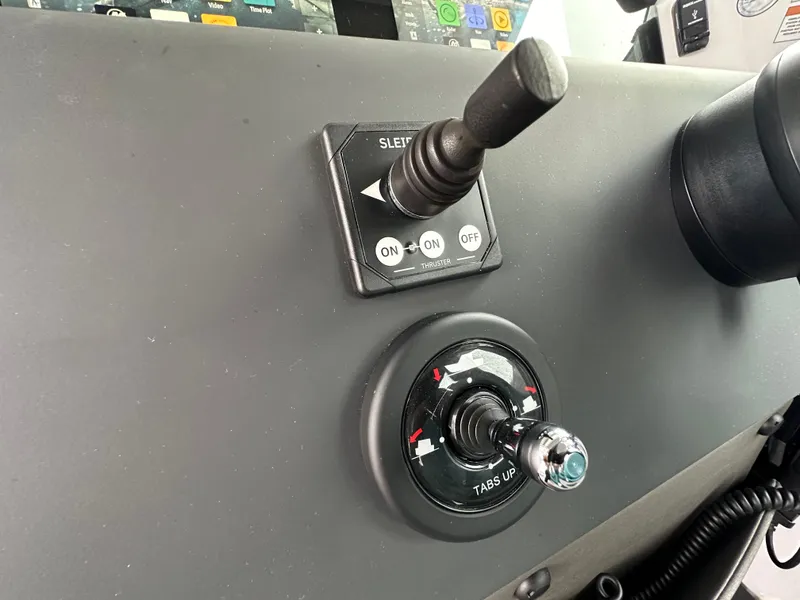 Slide: The Image of Control panel of 2023 Axopar 37 XC Crosscabin boat with switches and dials. - 10